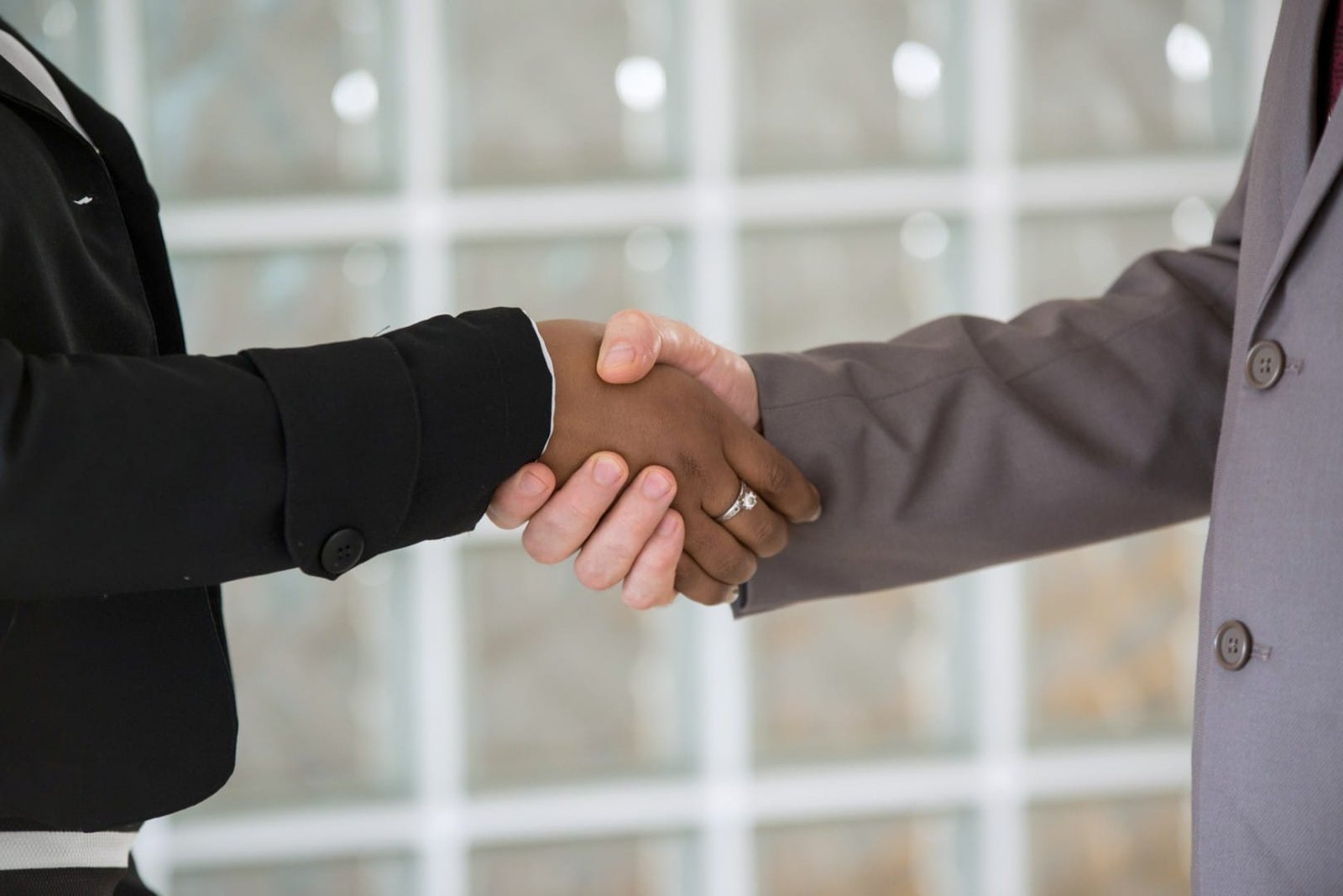 an-interracial-handshake-2024-10-17-04-10-02-utc